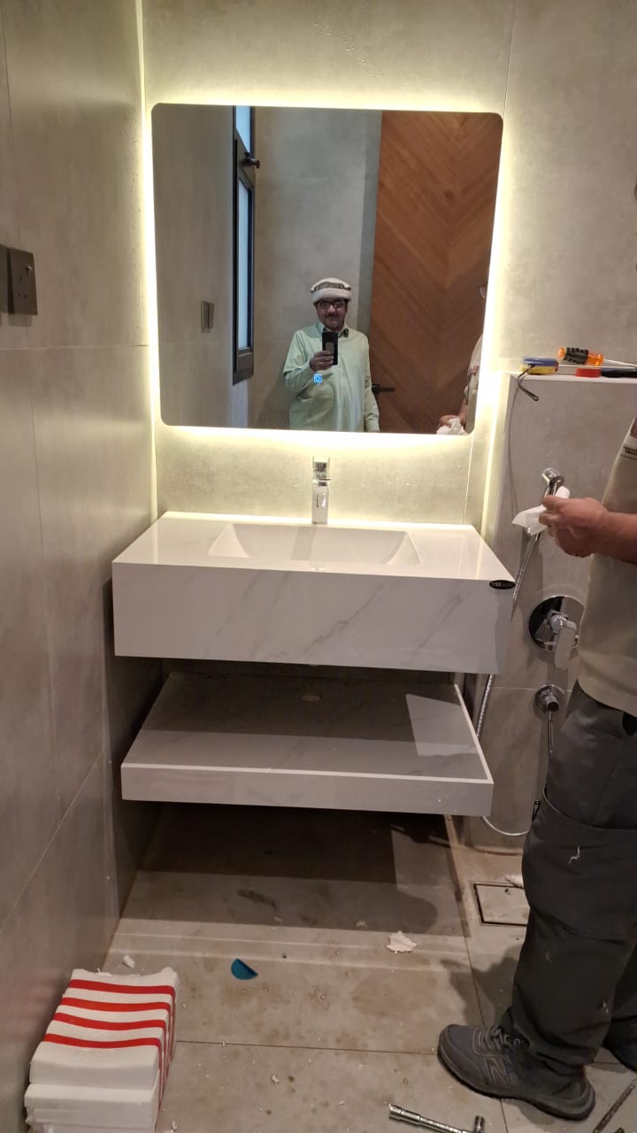 Neat grouting and tiled surfaces around a basin installed by Sabbaq Fannan Al Riyadh